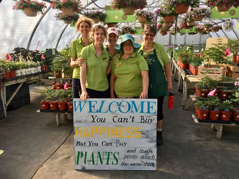 Our fabulous staff and our new sign!